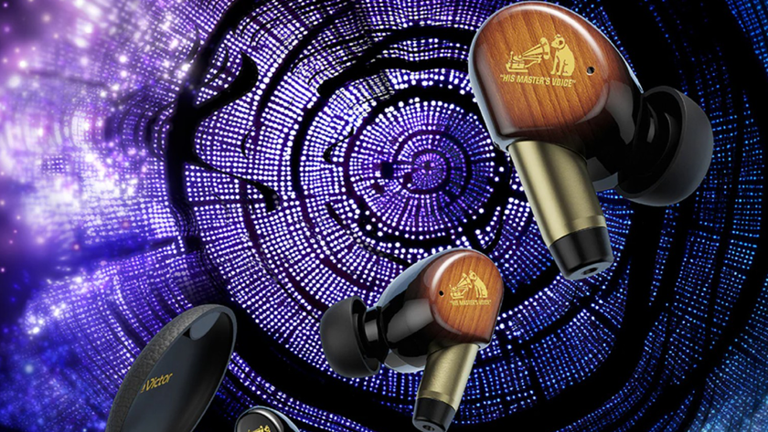 JVC Kenwood WOOD Master earbuds on a colored image of what appears to be a tree section