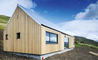 Low cost single storey self build home with timber cladding