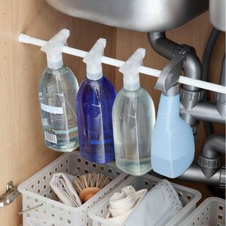kitchen cabinets and drawers with under sink bottle rail