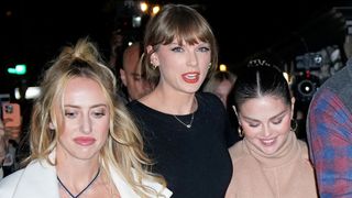 Brittany Mahomes, Taylor Swift and Selena Gomez walking down the street during a night on the town.