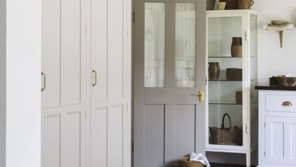 Bootility room with gray painted door in country style kitchen
