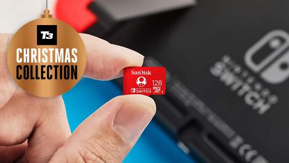 Sandisk official Nintendo SD card between user's thumb and finger