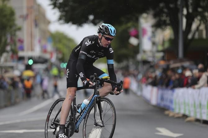 Chris Froome (Team Sky) takes it easy through a wet corner