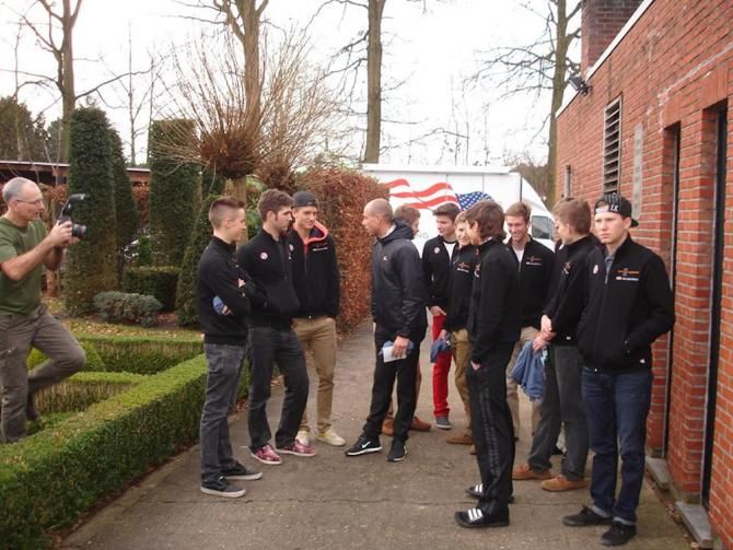 The Euro 'Cross Camp crew mingle with Sven Nys as they wait to take a group photo. Dennis Crane works on getting them all lined up.