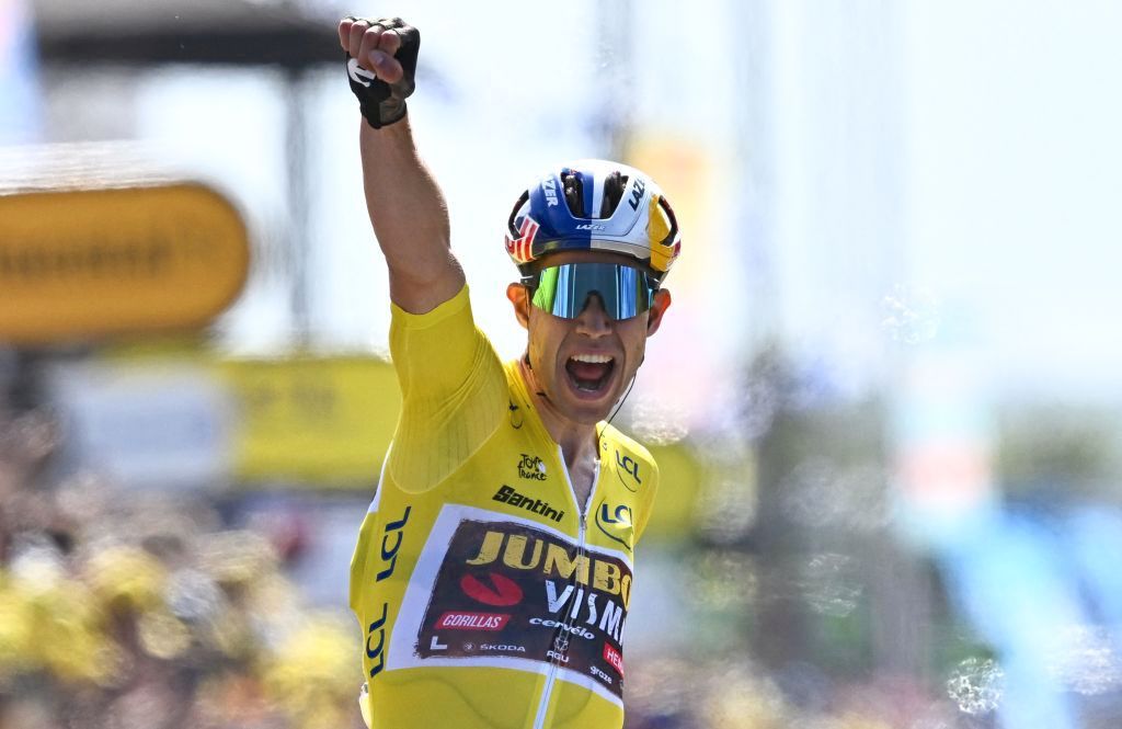 TOPSHOT - Jumbo-Visma team's Belgian rider Wout Van Aert celebrates as he cycles past the finish line to win the 4th stage of the 109th edition of the Tour de France cycling race, 171,5 km between Dunkirk and Calais, in northern France, on July 5, 2022. (Photo by Anne-Christine POUJOULAT / AFP) (Photo by ANNE-CHRISTINE POUJOULAT/AFP via Getty Images)