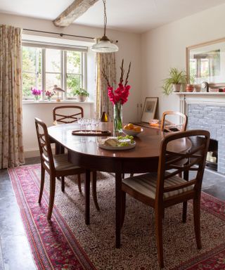antique table and chairs in a cottage dining room