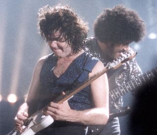 Gary Moore (left) and Phil Lynott perform onstage at the Hammersmith Odeon in London