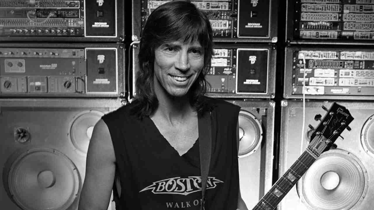 Boston&amp;rsquo;s Tom Scholz posing for a photograph with a guitar in 1994