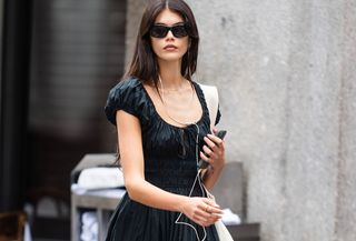 woman in black slip dress