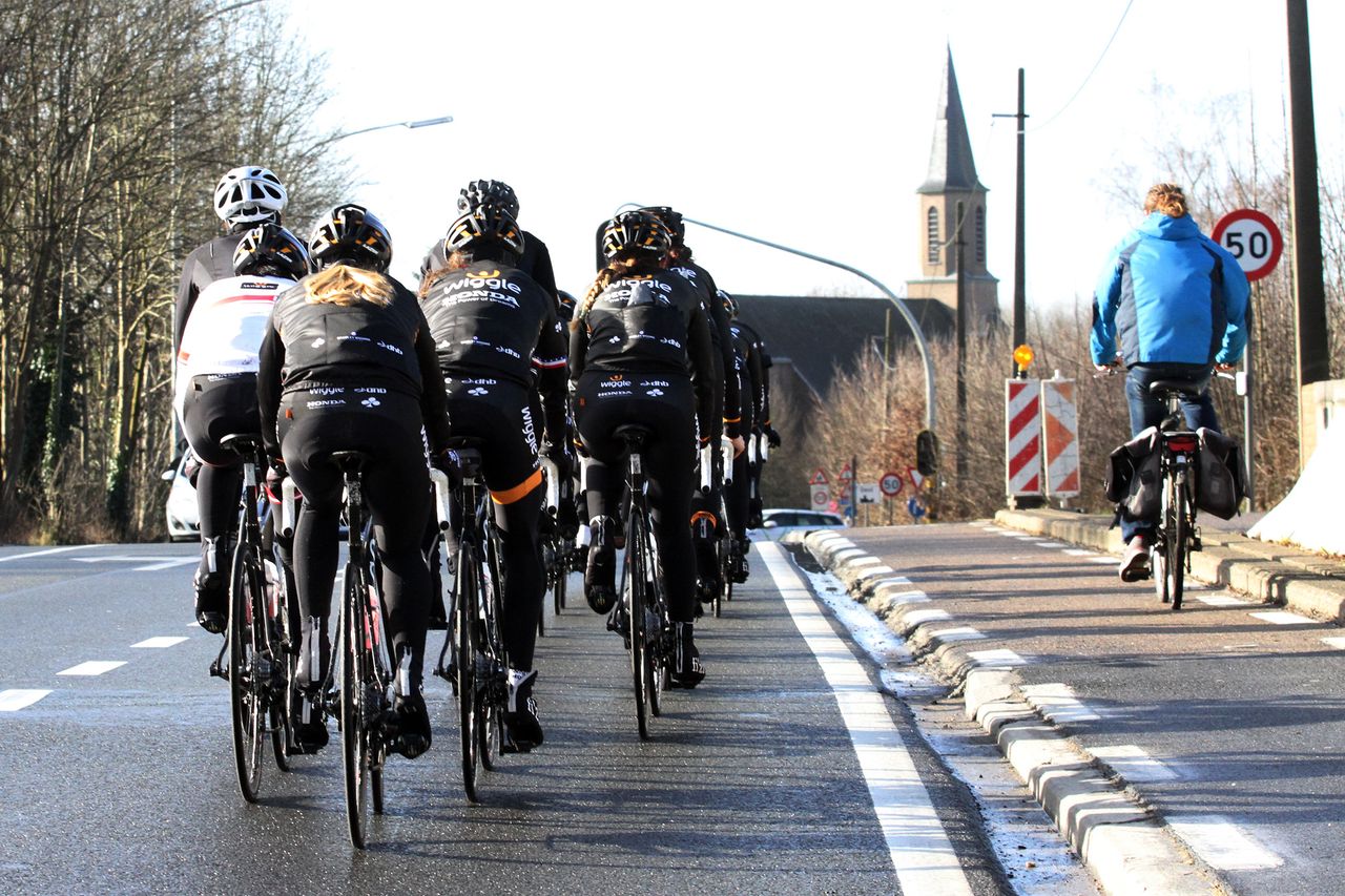 The team crests a beg while out on a training ride