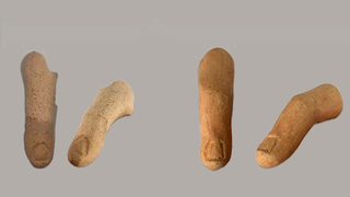 Two ceramic human fingers, with two views each