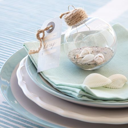 summer bauble with sand and shells with tag and plates