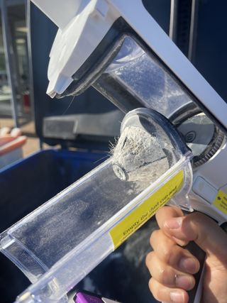 Shark Detect Pro Cordless with flour and hair stuck in dust cup filter