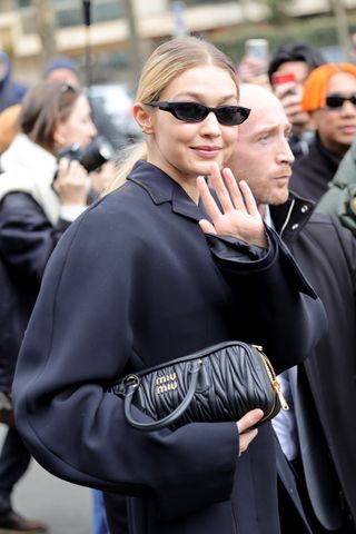 Gigi Hadid leaving Miu Miu show in all-black outfit
