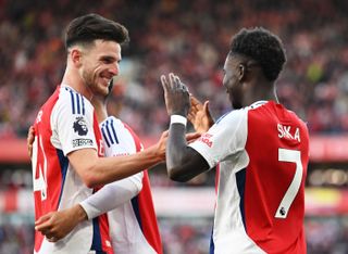 Arsenal players Declan Rice and Bukayo Saka celebrate