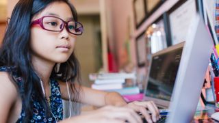 Revolution Prep versus TutorMe: Image shows young girl in front of laptop