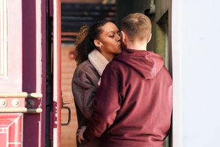 Dean Wicks and Gina Knight kiss outside the Vic in EastEnders 