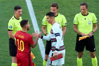 Eden Hazard of Belgium and Cristiano Ronaldo of Portugal interact during the coin toss conducted by Match Referee, Felix Brych prior to the UEFA Euro 2020 Championship Round of 16 match between Belgium and Portugal at Estadio La Cartuja