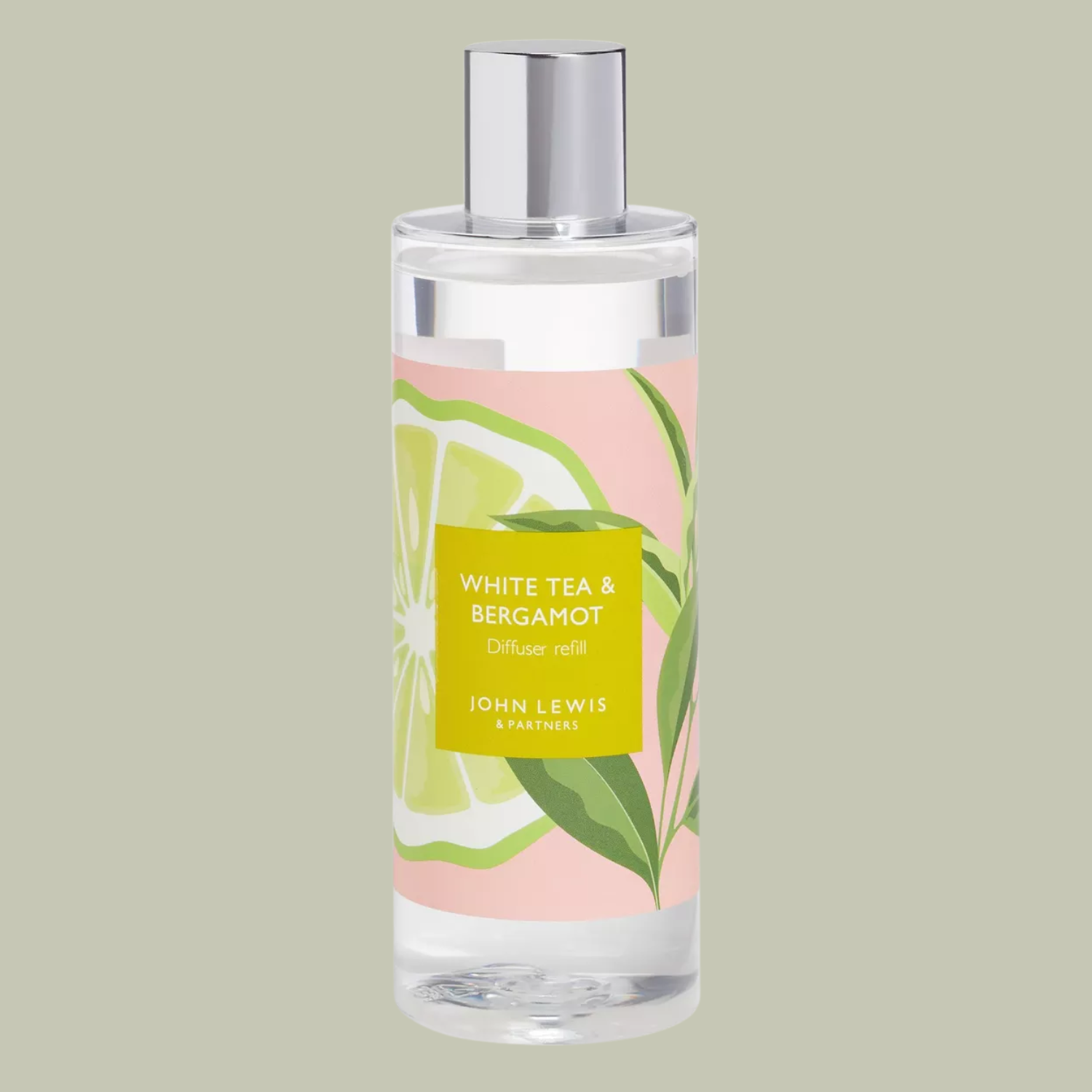 A bottle of reed diffuser refill against a light green background