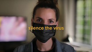 Woman wearing mask overlaid with the slogan 'Silence the virus'