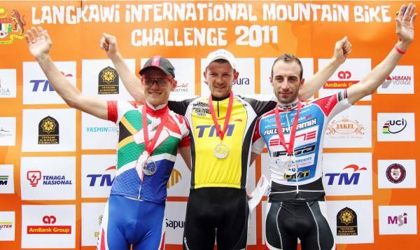 Karl Platt (centre) flanked by Burry Stander (left) and Johnny Cattaneo (right) on the podium on day 2 of LIMBC 2011