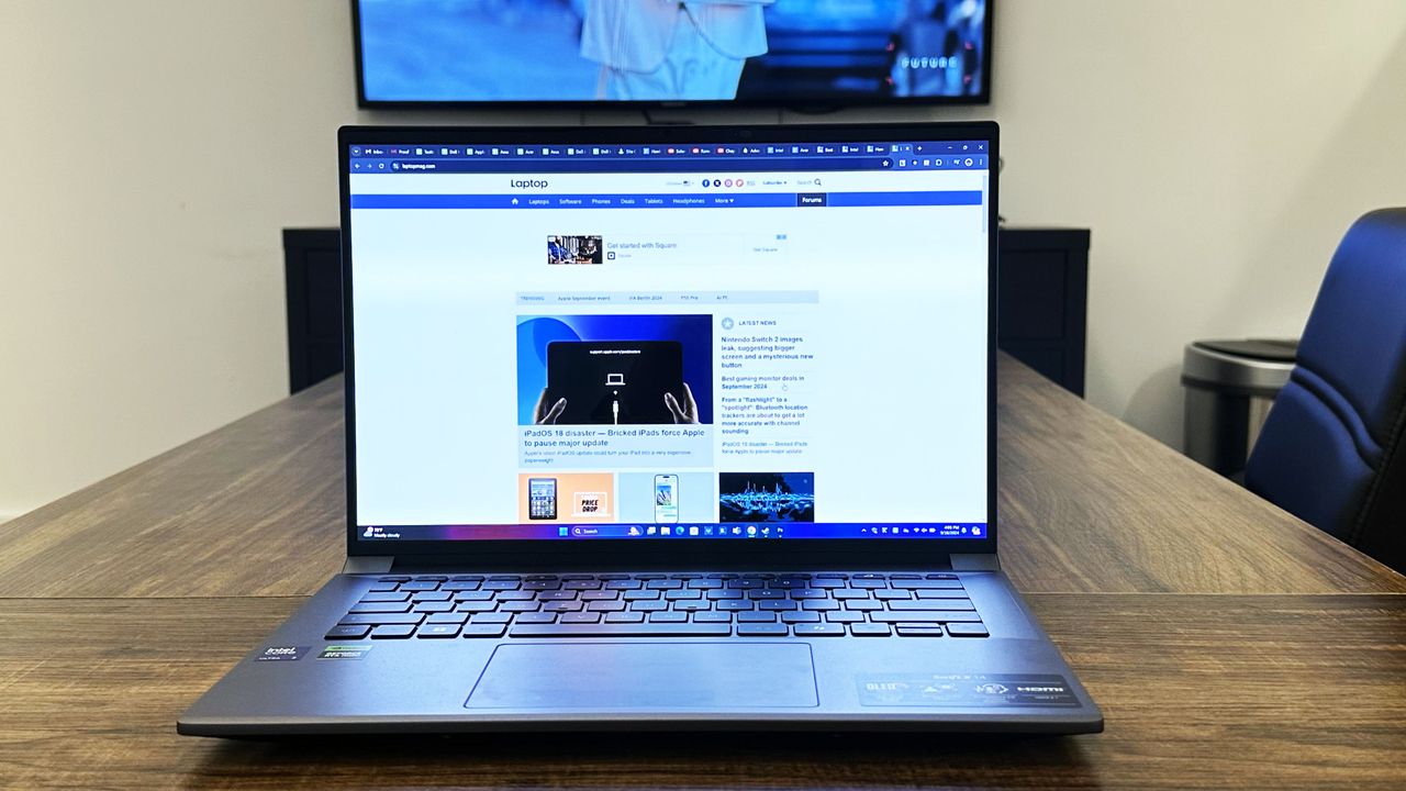 Acer Swift X 14 facing forward on a wooden table