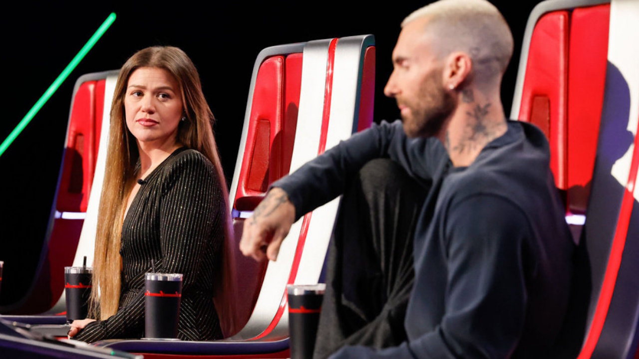 Kelly Clarkson looks at Adam Levine during The Voice Season 29.