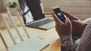 A man connects to wifi on his phone