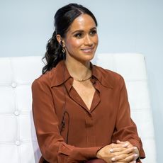 Meghan Markle wearing a brown co-ord and a gold Cartier necklace in Colombia August 2024