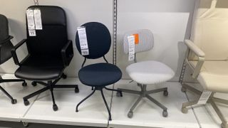 A row of office chairs on the shelf at IKEA