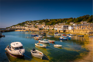 Photo of a bay in Cornwall with boats and beach