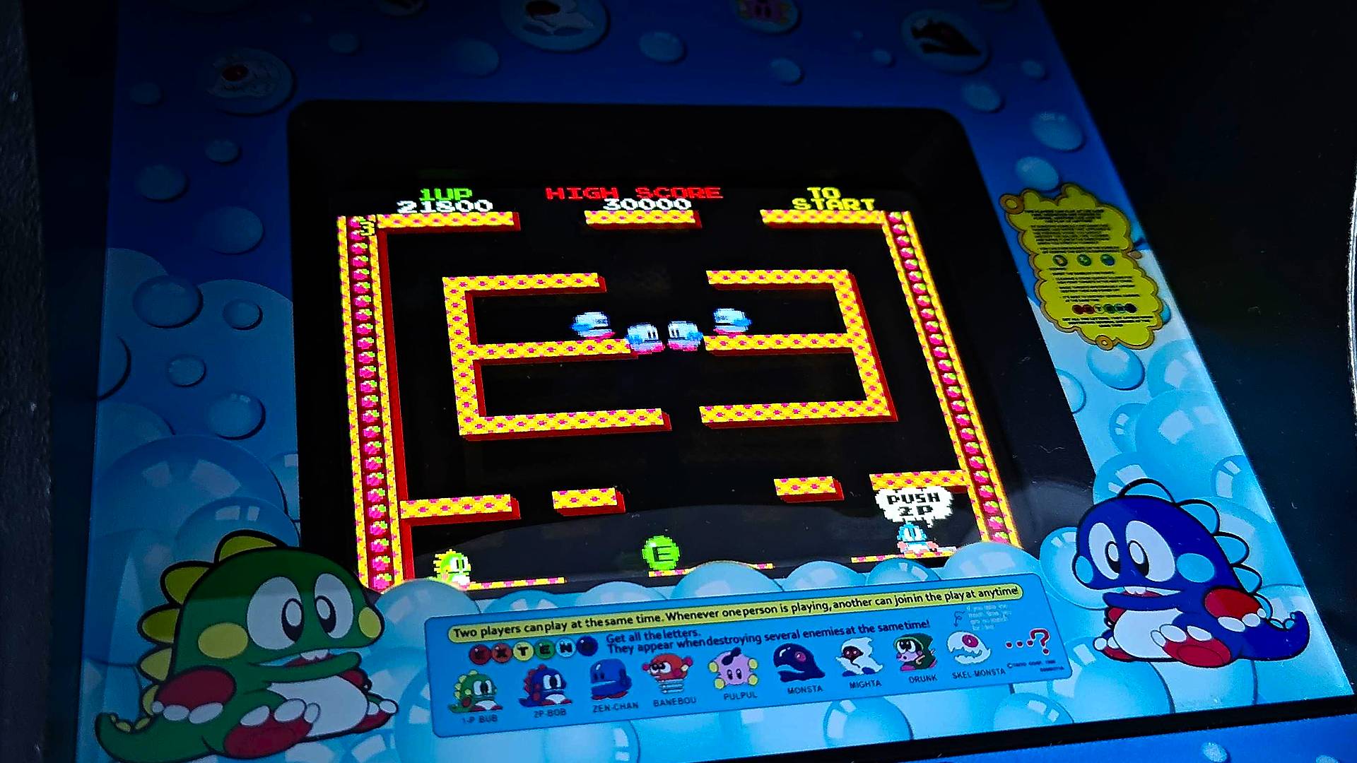 Un primer plano del juego de máquinas arcade Quartercade Taito Bubble Bobble