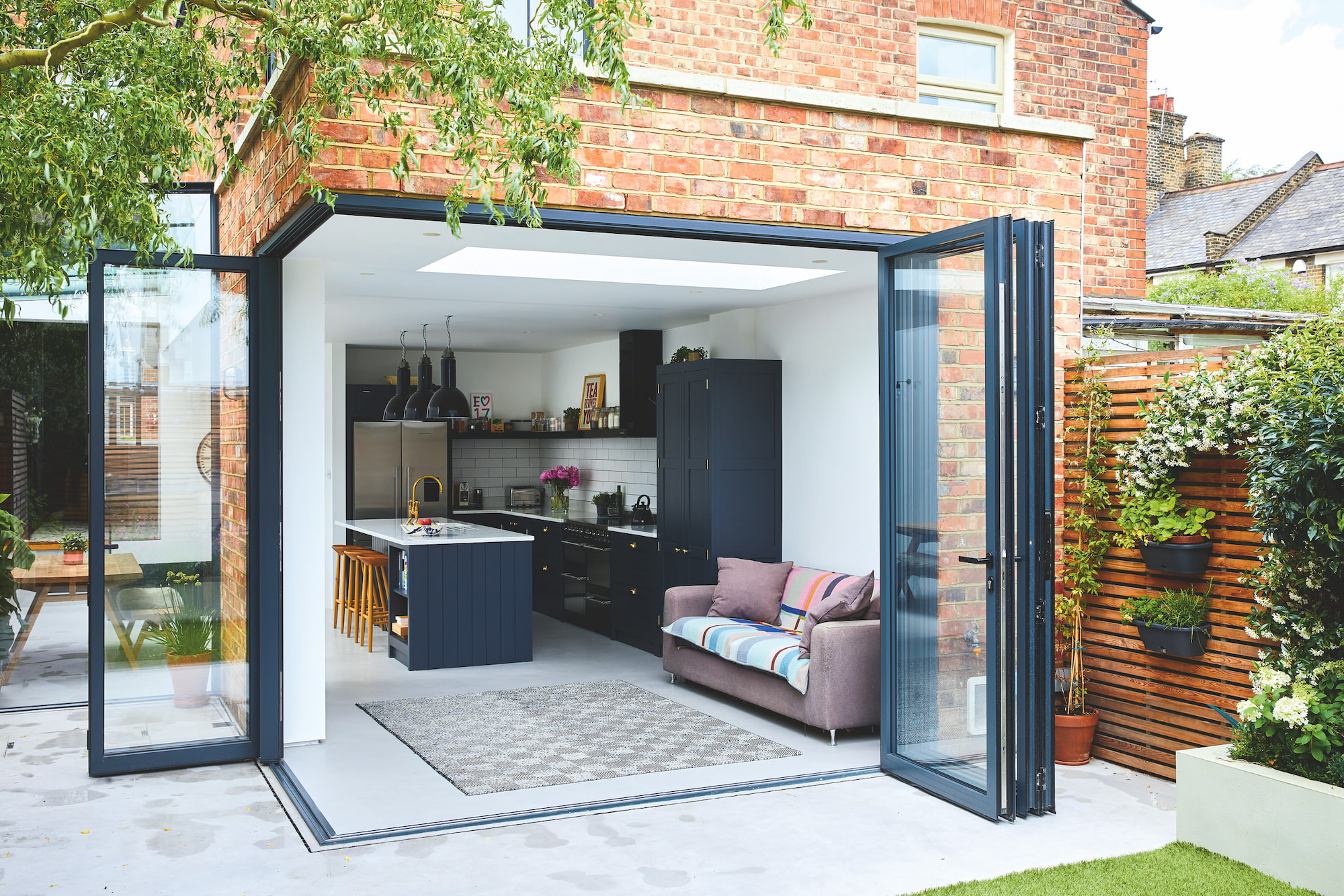 A small kitchen extension on the back of a red brick house