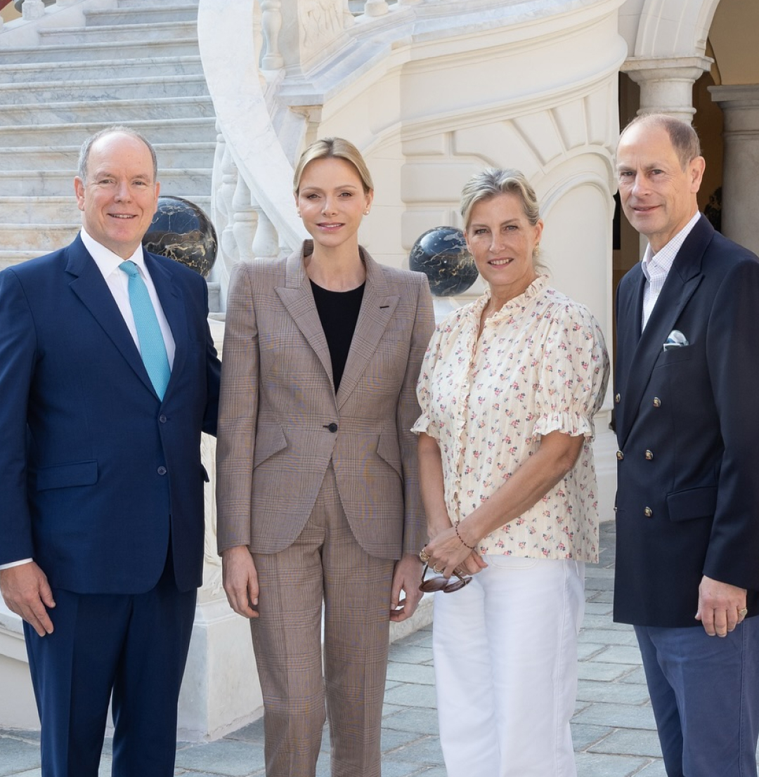Prince Albert, Princess Charlene, Duchess Sophie and Prince Edward posing in front of the palace in Monaco