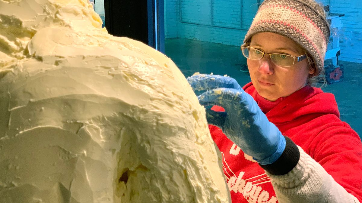 Tammy Buerk molds a sculpture of Neil Armstrong using large blocks of butter. The entire display, which is a tribute to the Apollo 11 moon landing, required more than 2,200 pounds of butter.