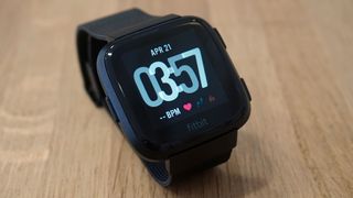 The Versa's screen is more rounded than the Apple Watch 4's