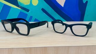 Photo of the Meta Ray-Ban Display (left) and Ray-Ban Meta (Gen 2, right), showing their relative thickness and designs.