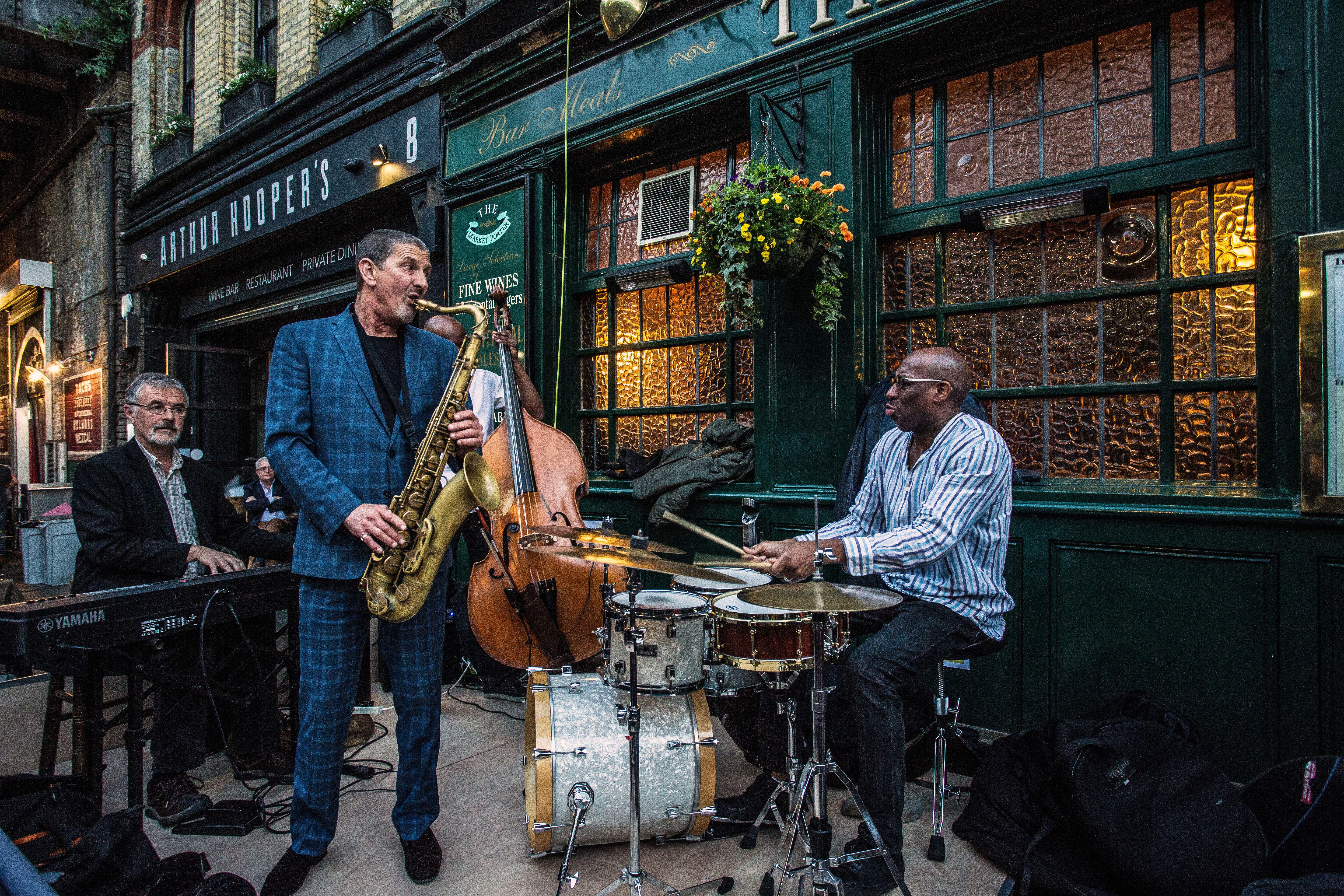 A live jazz band performs outside of the market porter pub in Borough Market