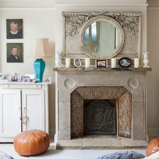 living room with fire place and wall mirror