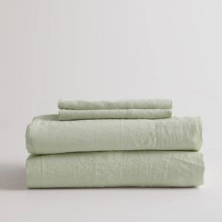European Linen Sheet Set in sage green against a white background.