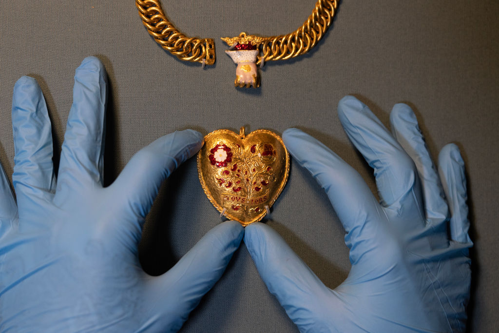A gold pendant is displayed during a photocall at The British Museum