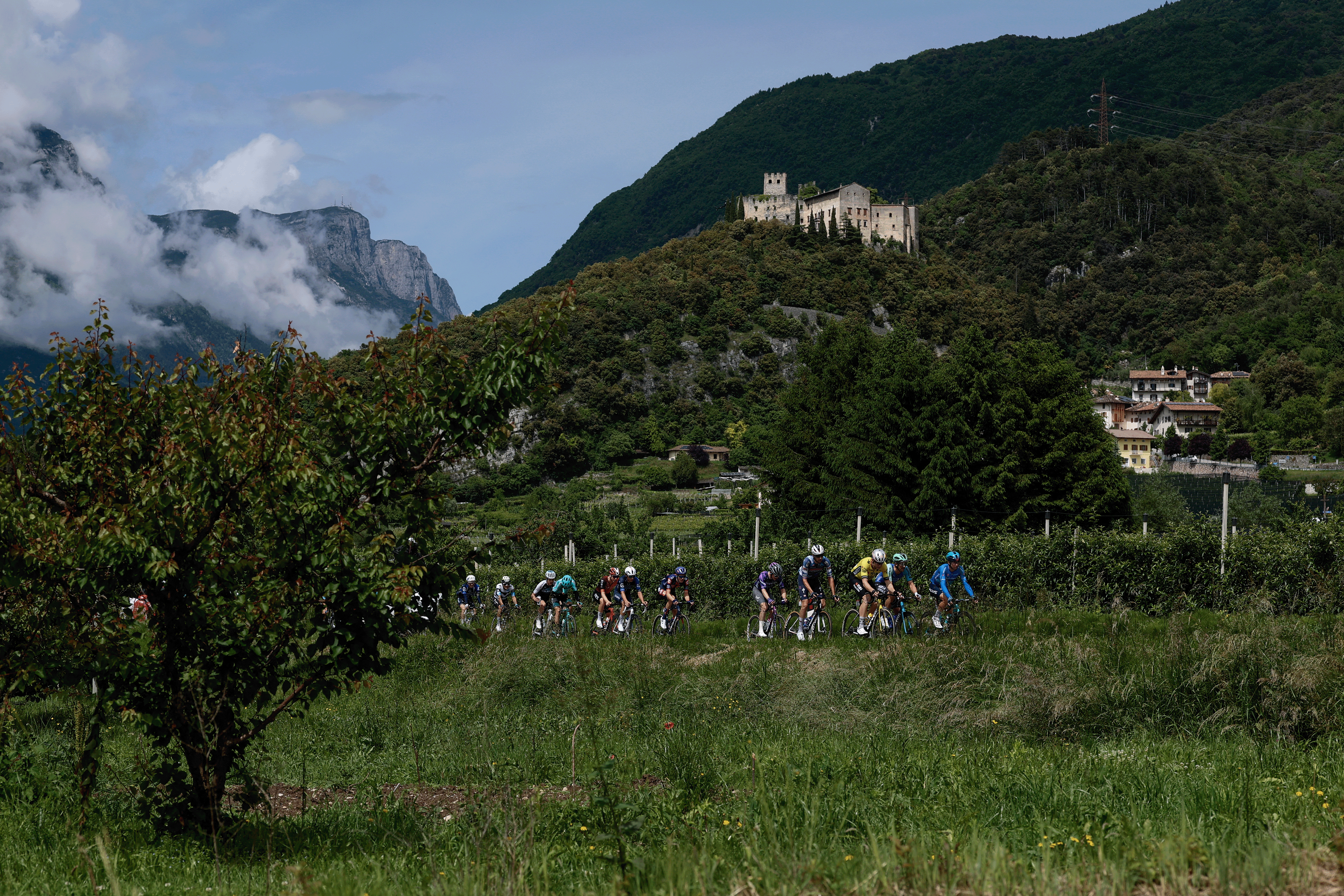 Riders pass Castel Madruzzo during the 16th stage of the 108th Giro d'Italia cycling race of 203kms from Piazzola sul Brenta to San Valentino on May 27, 2025. (Photo by Luca Bettini / AFP) (Photo by LUCA BETTINI/AFP via Getty Images)