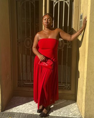 Nnenna wearing red dress