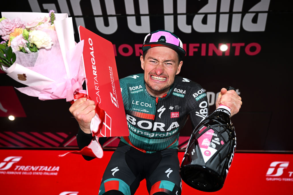 CASSANO MAGNAGO ITALY MAY 20 Nico Denz of Germany and Team BORA hansgrohe celebrates at podium as stage winner during the 106th Giro dItalia 2023 Stage 14 a 194km stage from Sierre to Cassano Magnago UCIWT on May 20 2023 in Cassano Magnago Italy Photo by Stuart FranklinGetty Images