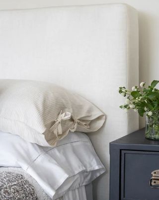 close up of white and cream pillows