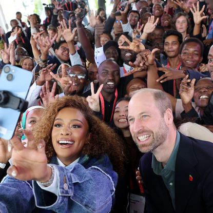 Prince William taking selfies with fans