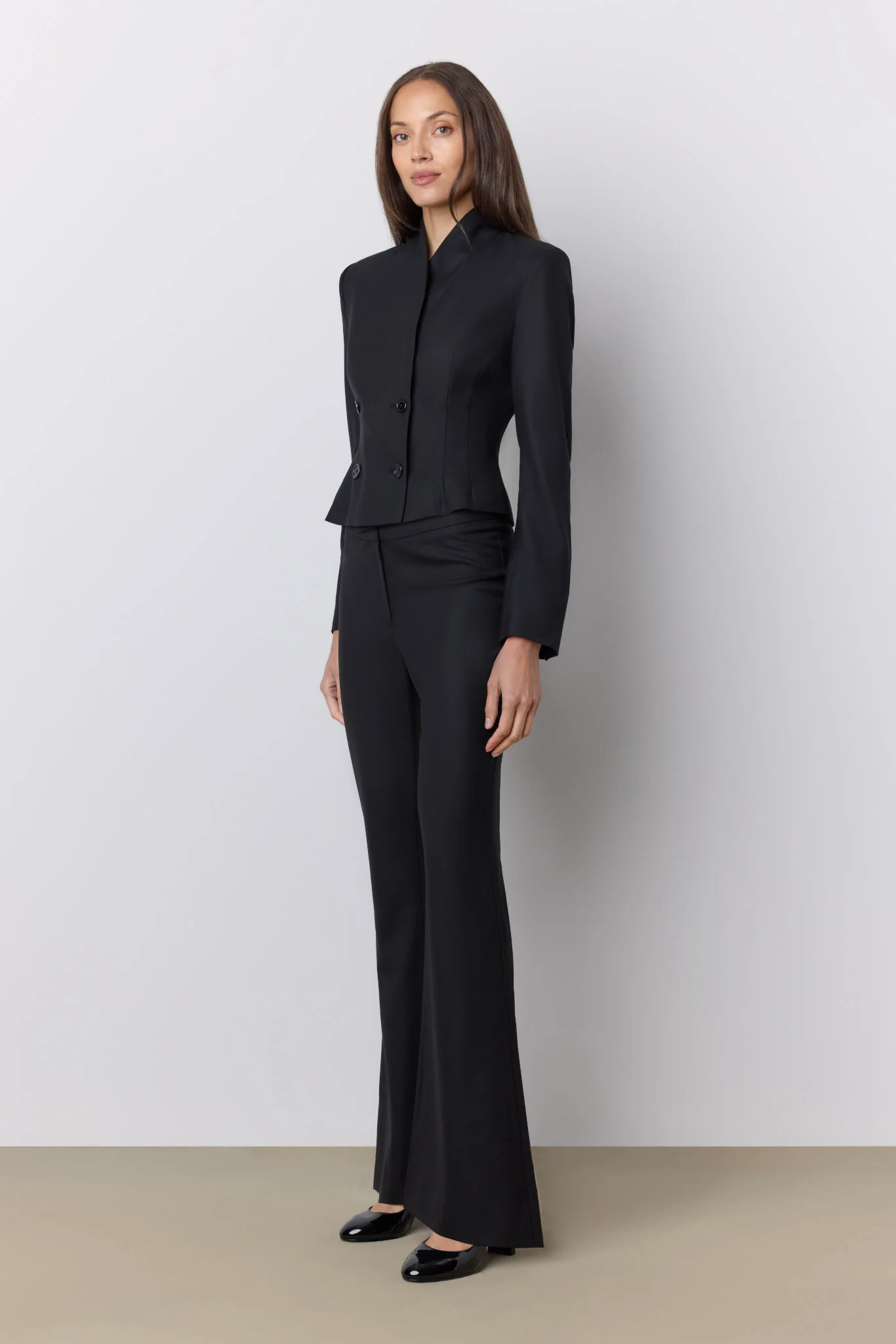 model wearing black trousers