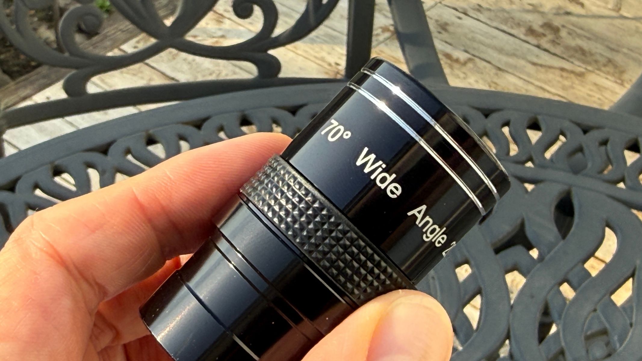 Fingers holding a 20mm eyepiece for the Sky-Watcher Heliostar 76mm H-alpha solar telescope.