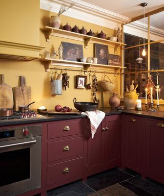 Yellow and burgundy kitchen with slate countertops