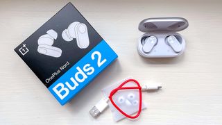 OnePlus Nord Buds 2 pachaging and accessories on a plain background